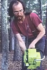 An instructor dramatizes the danger of chainsaw kickback.